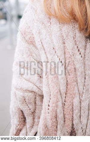 Young Beautiful Woman In A Cozy Nude Cardigan Spends Time Outdoors. Close Up. Without Face, Noface