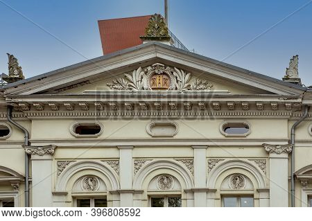 Klaipeda, Lithuania - July 10, 2020: Ornate Pediment Above The Entrance Of An Historic Building In T