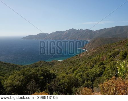 Landscape From The Coast Road With The Wonderful Bay Of Girolata With Rocky Cliffs Diving In The Sea