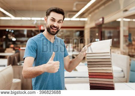 Satisfied Man Choose Color On Color Palette. Selecting Color Of Mattress On Color Palette Guide