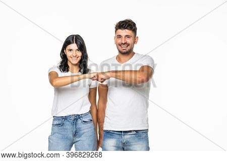 Relationships, Friendship And People Concept - Portrait Of Happy Couple In White T-shirts Making Fis