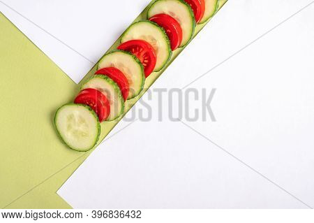 Сomposition Of Slices Of Cucumber And Tomato. Copy Space. Top View
