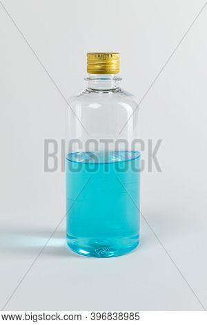 Blue ethanol alcohol liquid bottle