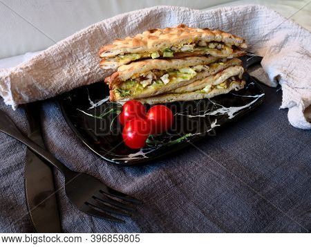 Whole-meal bread sandwich topped with Lyon rosette and butter