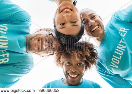 Group of happy and diverse volunteers