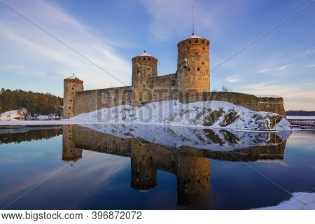 At The Old Fortress Of Olavinlinna (olafsborg) In The March Evening. Savonlinna, Finland