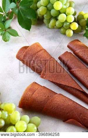 Natural Light Grape Marshmallow Is Rolled Into A Tube. Natural Bioproduct Without Preservatives. Foo
