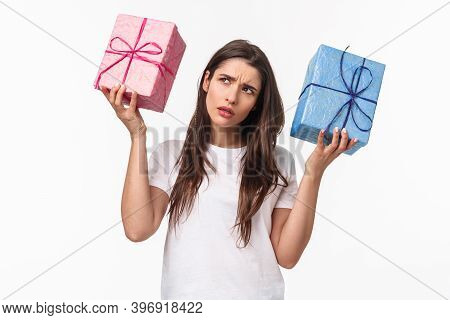 Celebration, Holidays And Presents Concept. Hmmm Interesting What Inside. Portrait Of Curious Young 