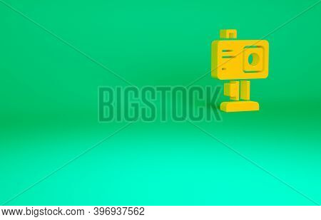 Orange Action Extreme Camera Icon Isolated On Green Background. Video Camera Equipment For Filming E