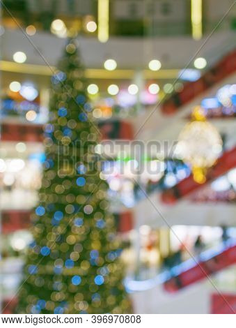 Сhristmas Tree In Shopping Mall, Defoused Holiday Background.