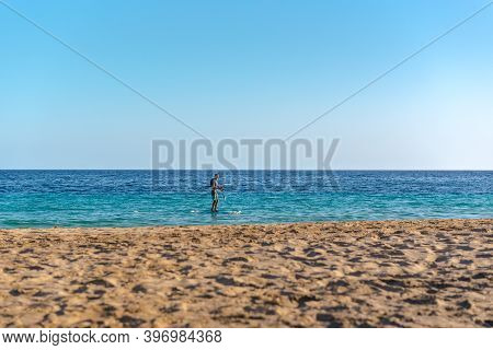 Morro Jable, Fuerteventura, Spain: 2020 October 08: Man Paddle Surfing From Morro Jable On Fuerteven