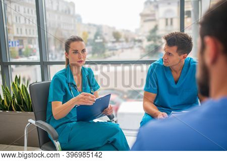 Medical Workers Having A Changeover And Talking