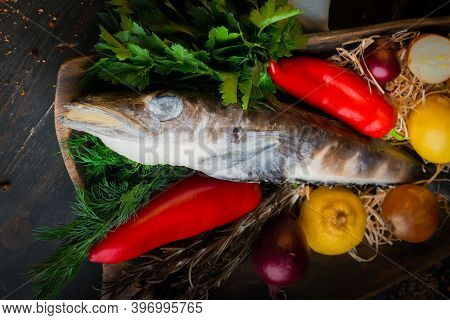 Mackerel Icefish With Ingredients For Cooking In A Wooden Bowl