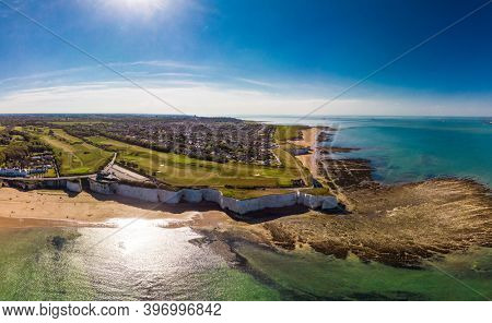 Drone aerial view of the beach and white cliffs on sunny day, Margate, England, UK