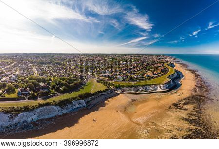 Drone aerial view of the beach and white cliffs on sunny day, Margate, England, UK