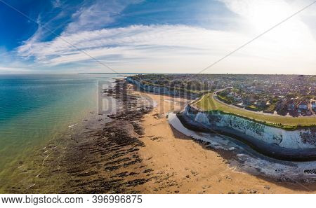 Drone aerial view of the beach and white cliffs on sunny day, Margate, England, UK