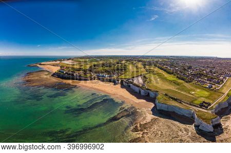 Drone aerial view of the beach and white cliffs on sunny day, Margate, England, UK