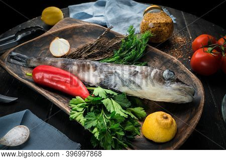 Mackerel Icefish With Ingredients For Cooking In A Wooden Bowl