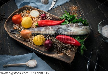 Mackerel Icefish With Ingredients For Cooking In A Wooden Bowl