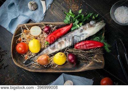 Mackerel Icefish With Ingredients For Cooking In A Wooden Bowl