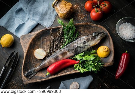 Mackerel Icefish With Ingredients For Cooking In A Wooden Bowl
