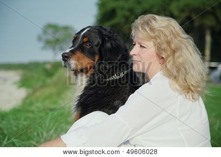 Dog And Woman Sitting