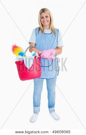 Smiling maid holding a pink bucket in the white background