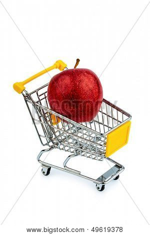 an apple is in a shopping cart. photo icon for the purchase of healthy, vitamin-rich foods.