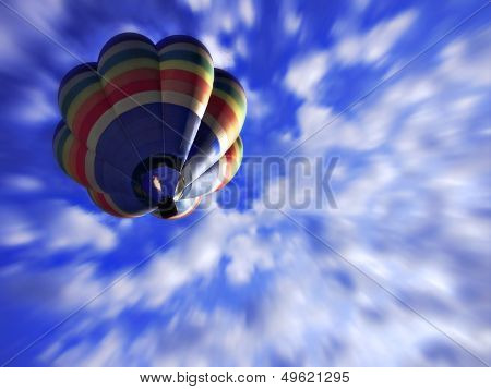 Rainbow coloured balloon gliding on a bright sunny day