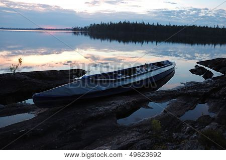 Canoe At Stone Bank Of Engozero Lake,polar Karelia, Russia