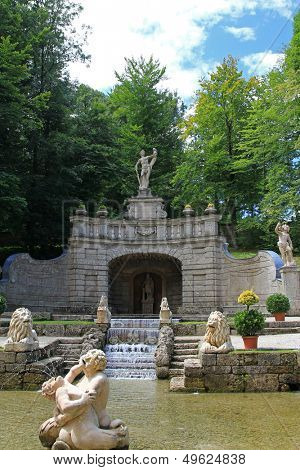 SALZBURG, AUSTRIA - AUGUST 2012 : The Altemps Fountain - Waterfall and sculptures at Schloss Hellbrunn, a Waterpark at the Summer Palace on August 14, 2012 in Salzburg, Austria. 