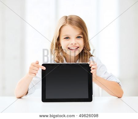education, school, technology and internet concept - little student girl with tablet pc at school