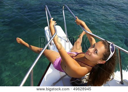 playful pretty girl on sail boat