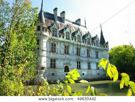 romantic Azey castle with green park