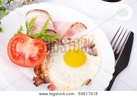 Fried eggs on a frying pan with olive oil