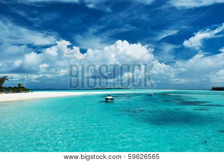 Beautiful island beach with sandspit at Maldives