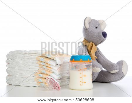 New Born Child Stack Of Diapers, Nipple Soother, Teddy Bear Toy