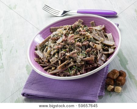 pizzocheri with sausage spinach and hazelnut