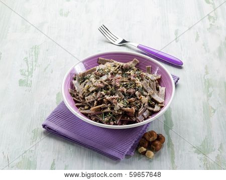 pizzocheri with sausage spinach and hazelnut