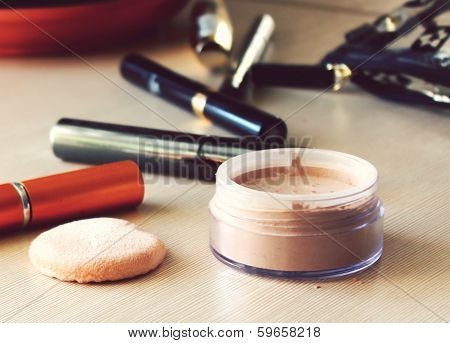 Compact pocket powder and a powder puff and other cosmetics