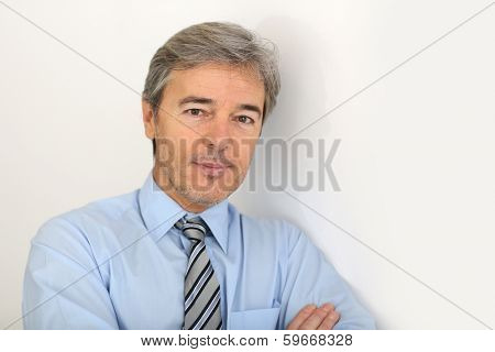 Portrait of mature businessman, isolated