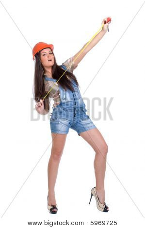 Woman in orange helmet holding tape measure