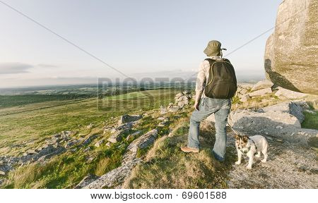 Woman Hiking With Dog