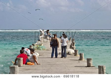 People on a twisted pier in Mexico