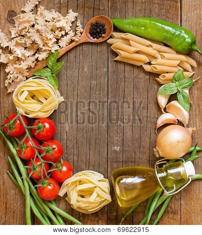 Pasta, Vegetables And Herbs On Wood