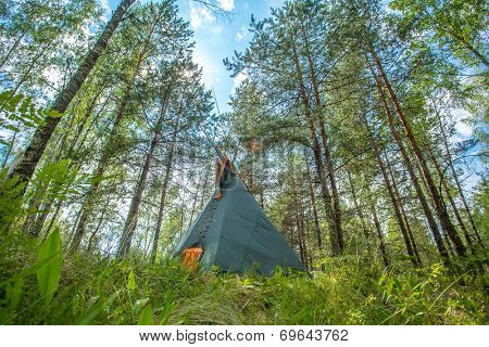 Traditional Indian tipi (teepee) house in the forest