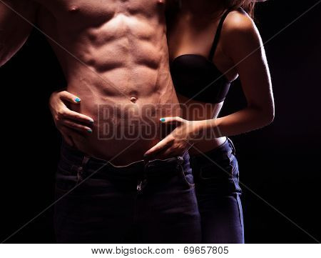 Woman Craving Very Sexy Male Six Pack Abs. Isolated on Black Background