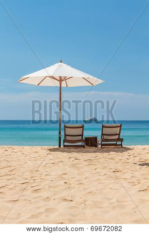 Sunbeds and umbrella on Freedom beach Koh Phuket in Thailand