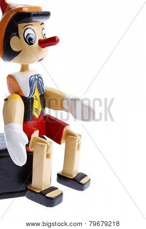 Wooden pinocchio on plain background