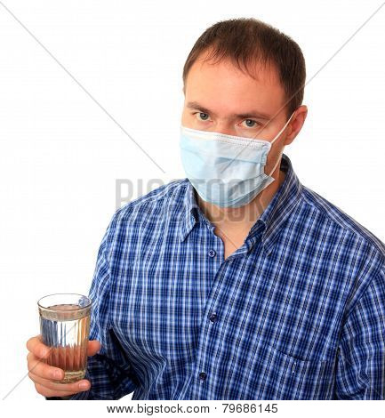 Man in a medical mask with water.